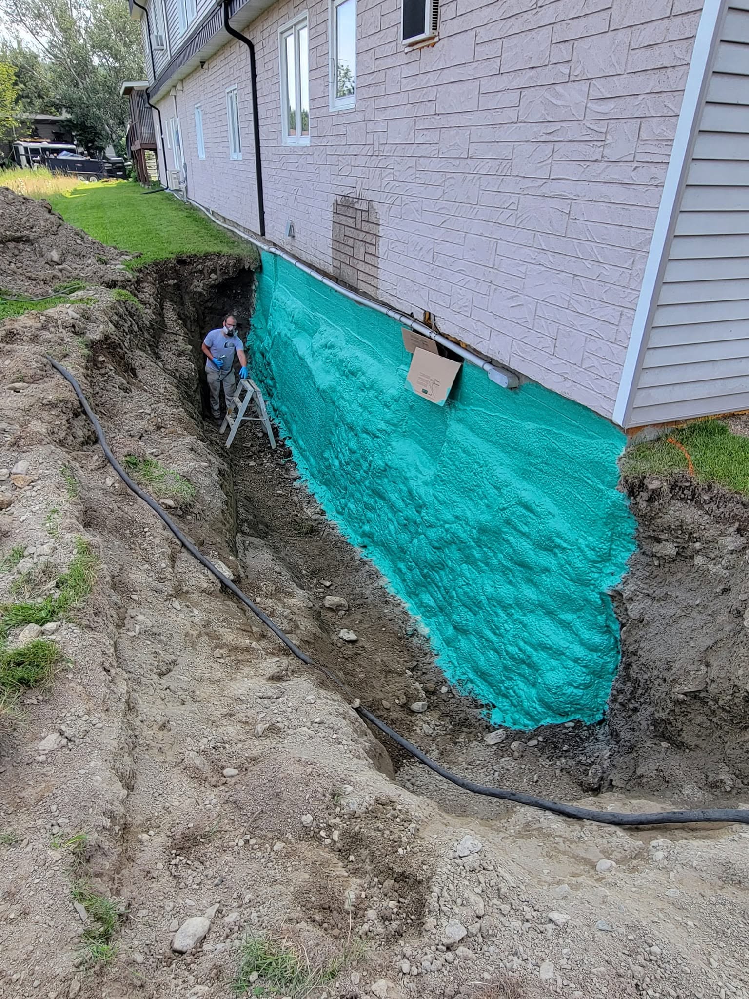 Full foundation waterproofing spray application